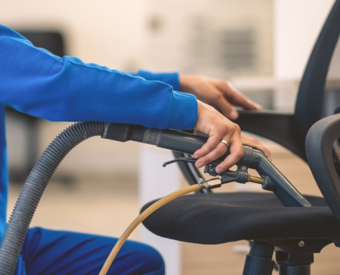 Close up view of commercial deep cleaning a chair